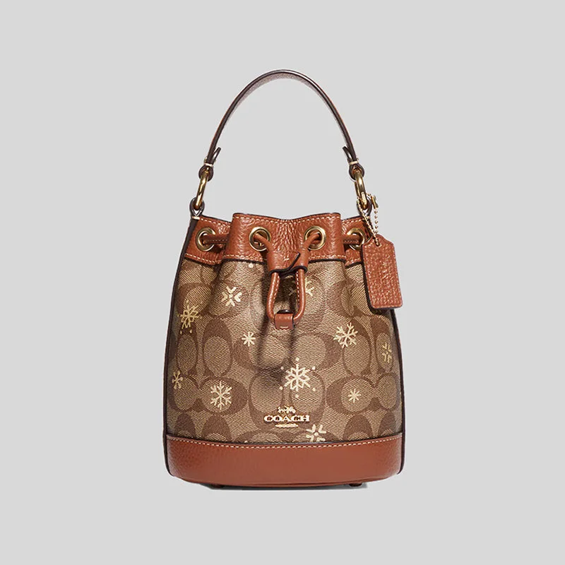 COACH Dempsey Drawstring Bucket Bag 15 In Signature Canvas With Snowflake Print Khaki Multi CE587